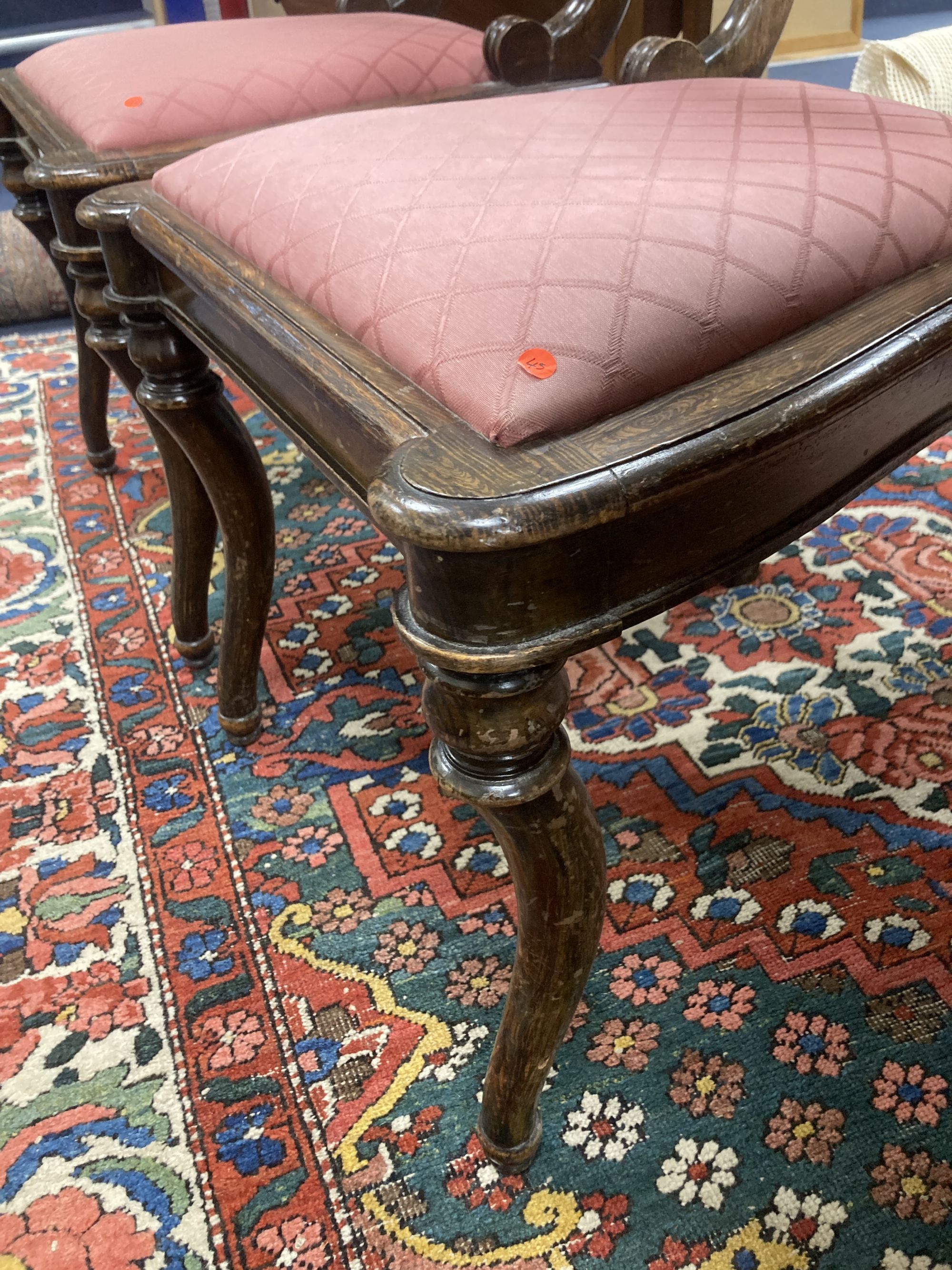 A pair of Regency beech simulated rosewood brass inlaid dining chairs, with pink upholstered seats